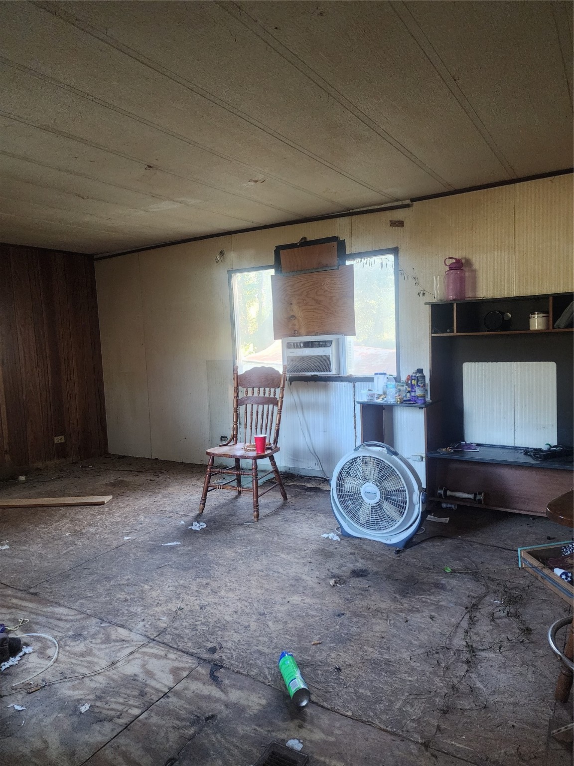 a view of a room with a table and a chair