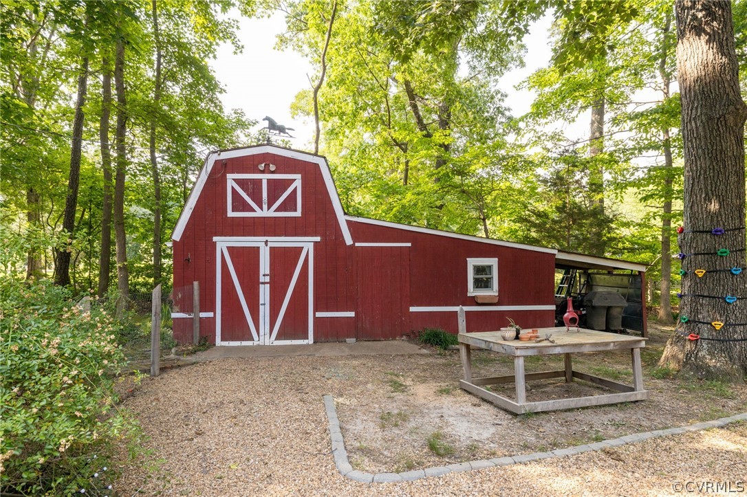 13473 Miller Road Chester, VA 23831 - Photo 42 of 50 a backyard of a house with table and chairs