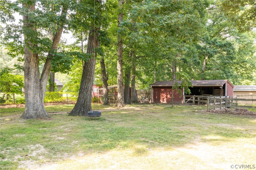 13473 Miller Road Chester, VA 23831 - Photo 44 of 50 a swimming pool with outdoor seating and yard