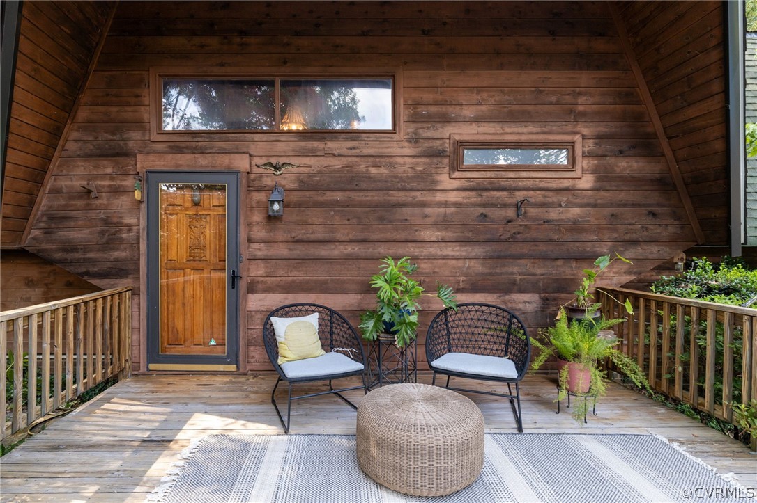 13473 Miller Road Chester, VA 23831 - Photo 8 of 50 a view of a porch with furniture and a gate