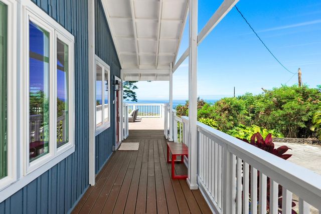 a view of a balcony with wooden floor