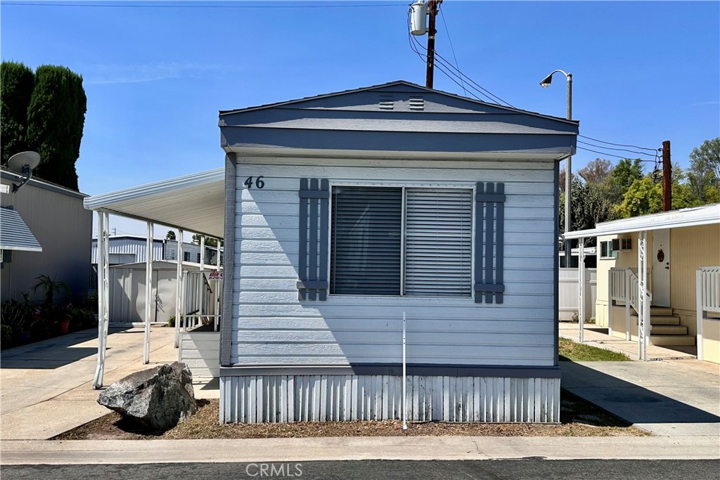 a view of a house with a door and wooden floor