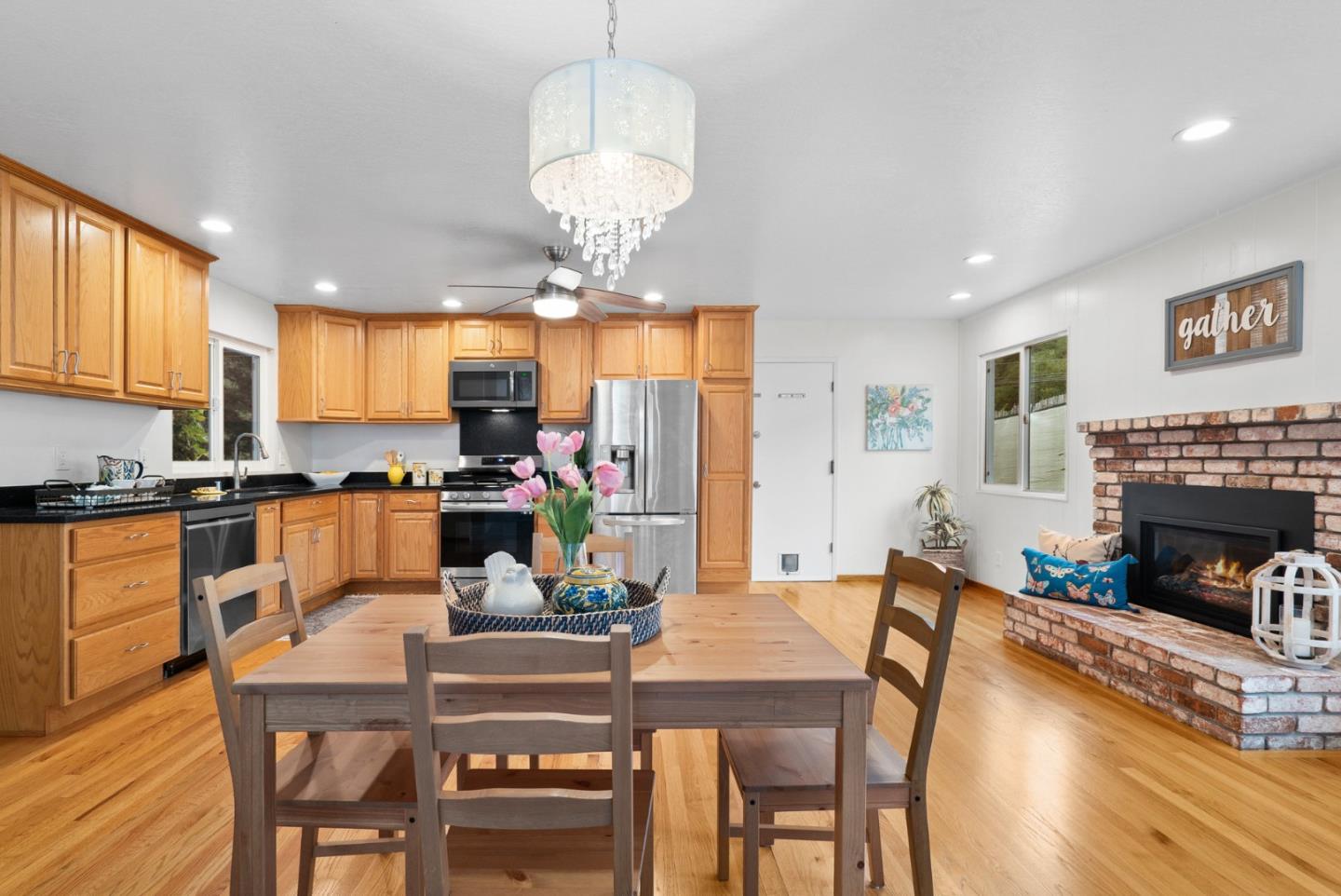 314 Hames Road Watsonville, CA 95076 - Photo 12 of 32 a view of a dining room with furniture a chandelier and wooden floor