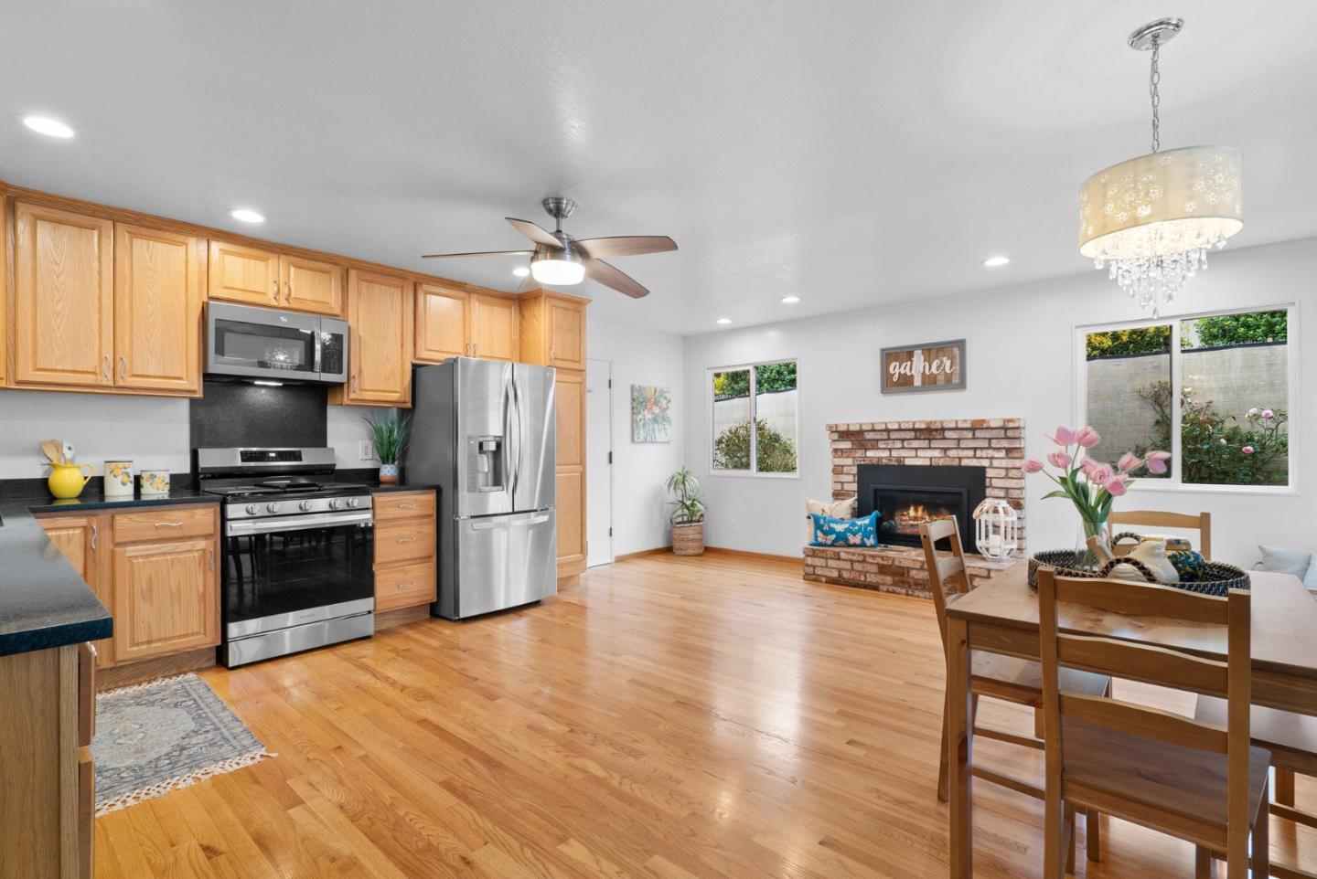 314 Hames Road Watsonville, CA 95076 - Photo 15 of 32 a kitchen with stainless steel appliances granite countertop a stove top oven a refrigerator and a fireplace