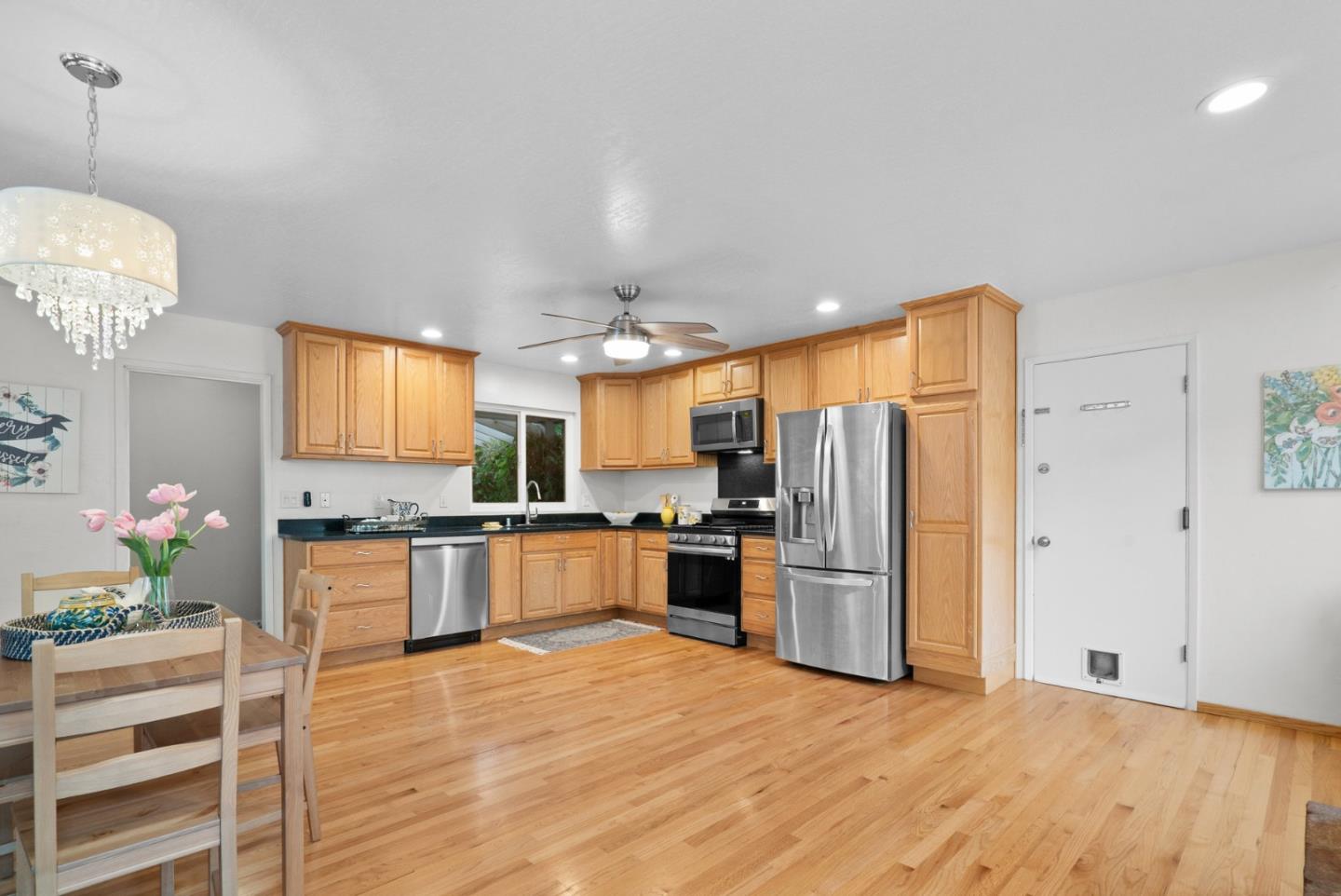 314 Hames Road Watsonville, CA 95076 - Photo 17 of 32 a large kitchen with cabinets wooden floor and stainless steel appliances