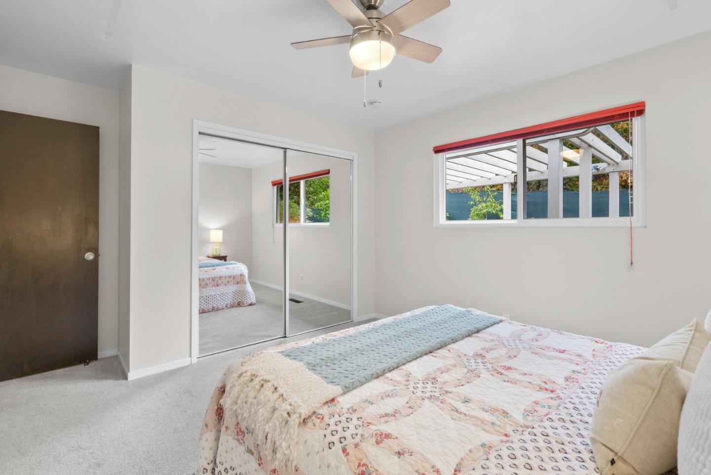 314 Hames Road Watsonville, CA 95076 - Photo 23 of 32 a bedroom with a bed and a chandelier