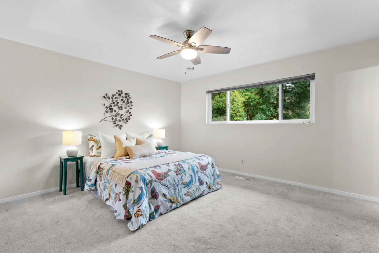 314 Hames Road Watsonville, CA 95076 - Photo 24 of 32 a bedroom with a bed and a chandelier