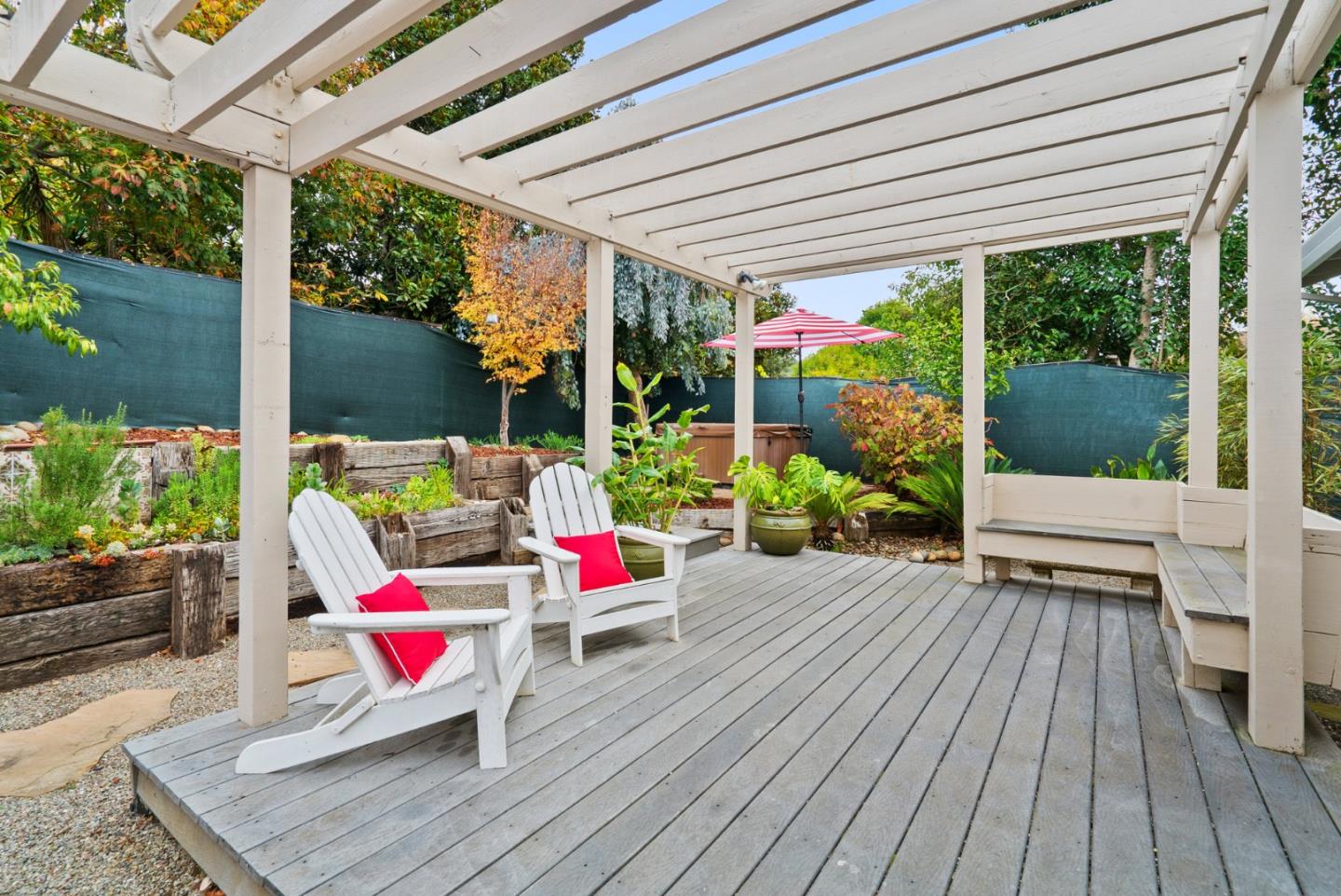 314 Hames Road Watsonville, CA 95076 - Photo 28 of 32 a view of a patio with table and chairs potted plants with wooden floor and floor to ceiling window