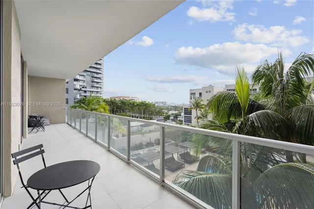 a view of balcony with furniture