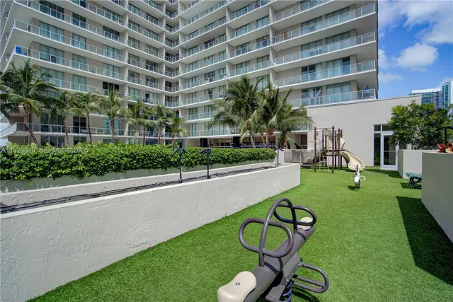 a house view with a seating space and a swimming pool in front of it
