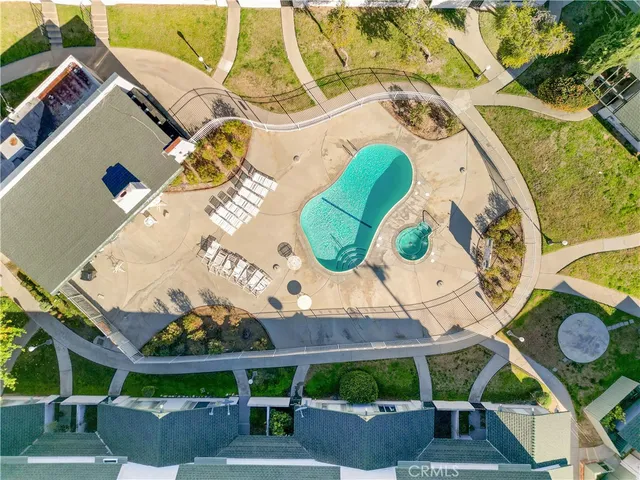 an aerial view of a house with a swimming pool