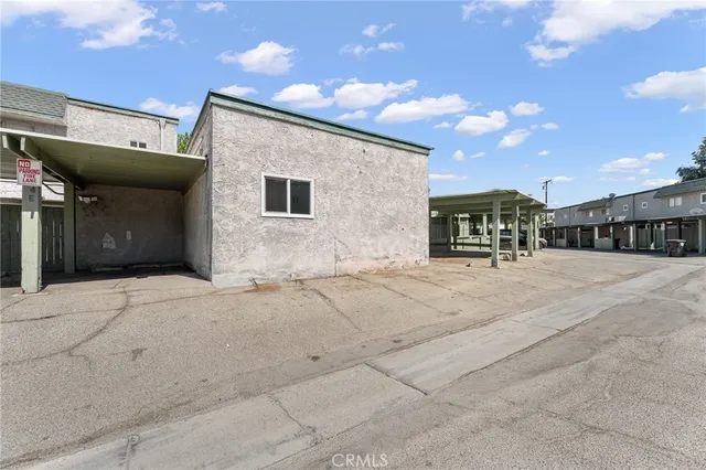a view of a house with basketball court