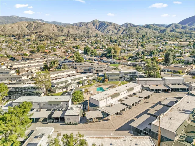an aerial view of residential houses with outdoor space