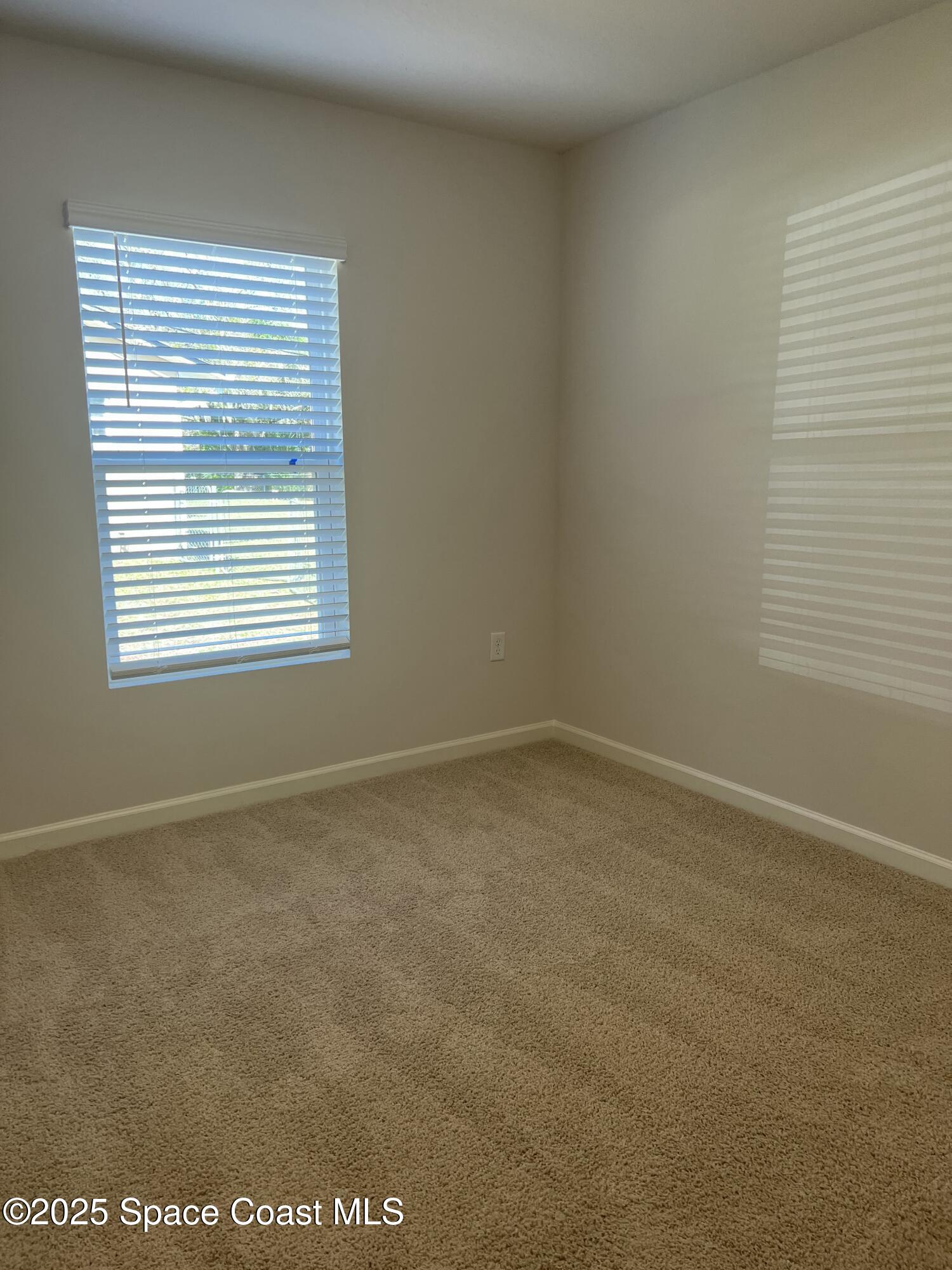 881 Hollahan Road Southeast Palm Bay, FL 32909 - Photo 8 of 21 a view of an empty room with a window