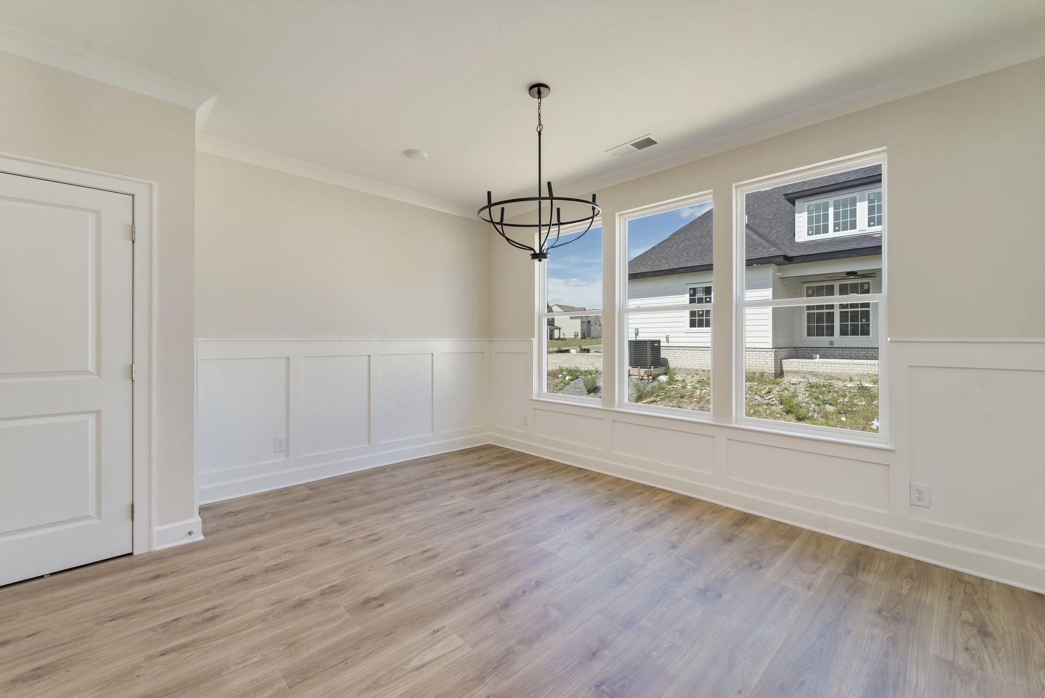 3005 Fanshaw Road Smyrna, TN 37167 - Photo 12 of 40 a view of an empty room with wooden floor and a window