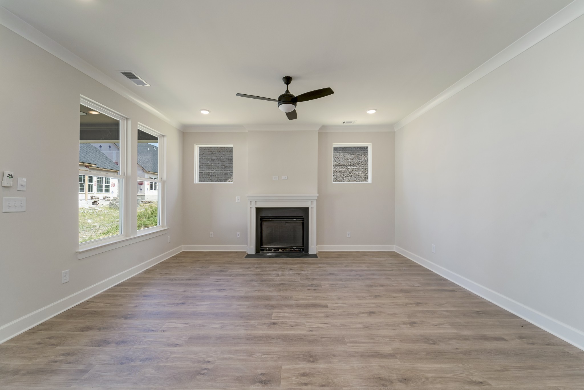 3005 Fanshaw Road Smyrna, TN 37167 - Photo 16 of 40 an empty room with windows and fireplace