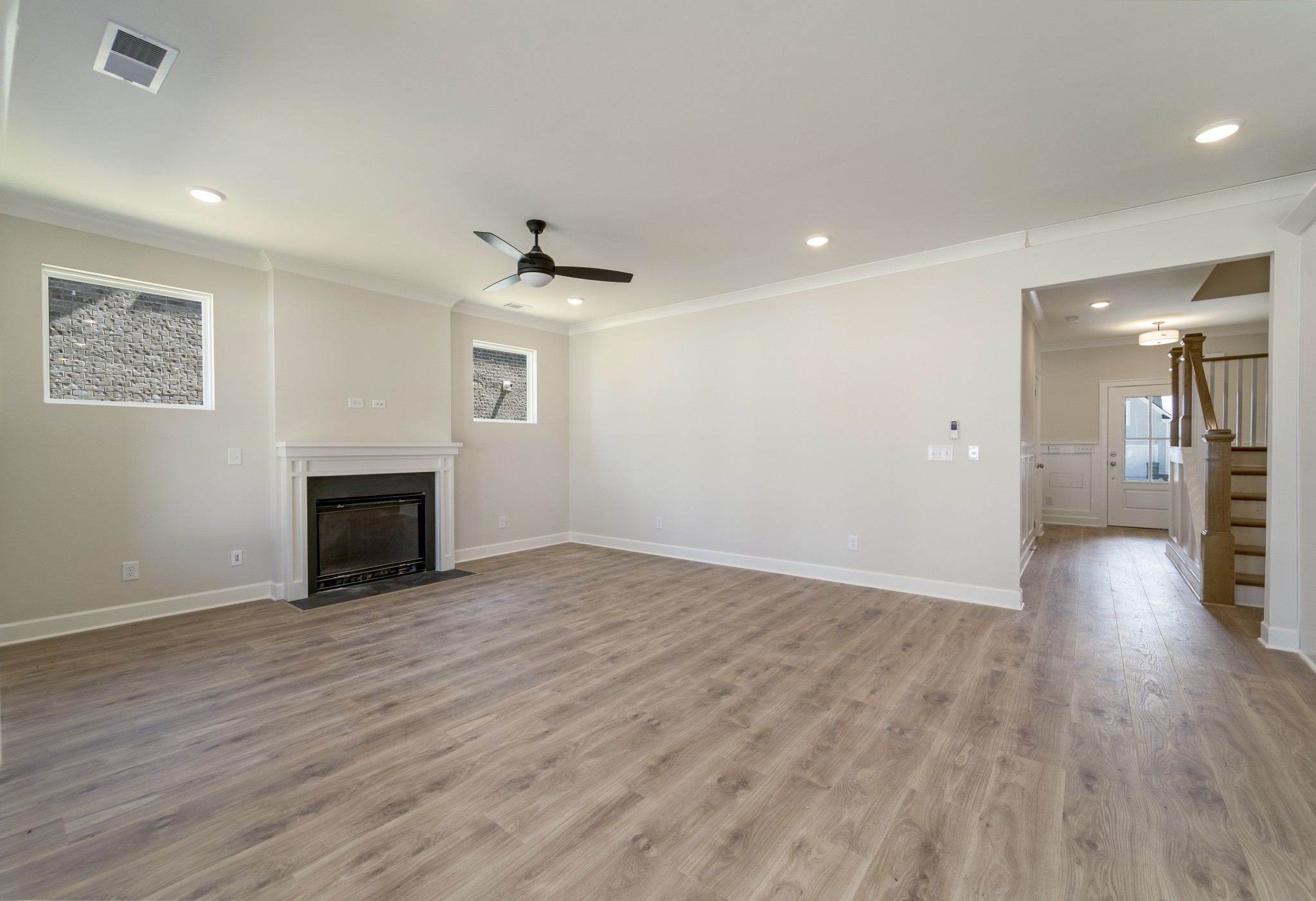 3005 Fanshaw Road Smyrna, TN 37167 - Photo 17 of 40 an empty room with wooden floor and fireplace