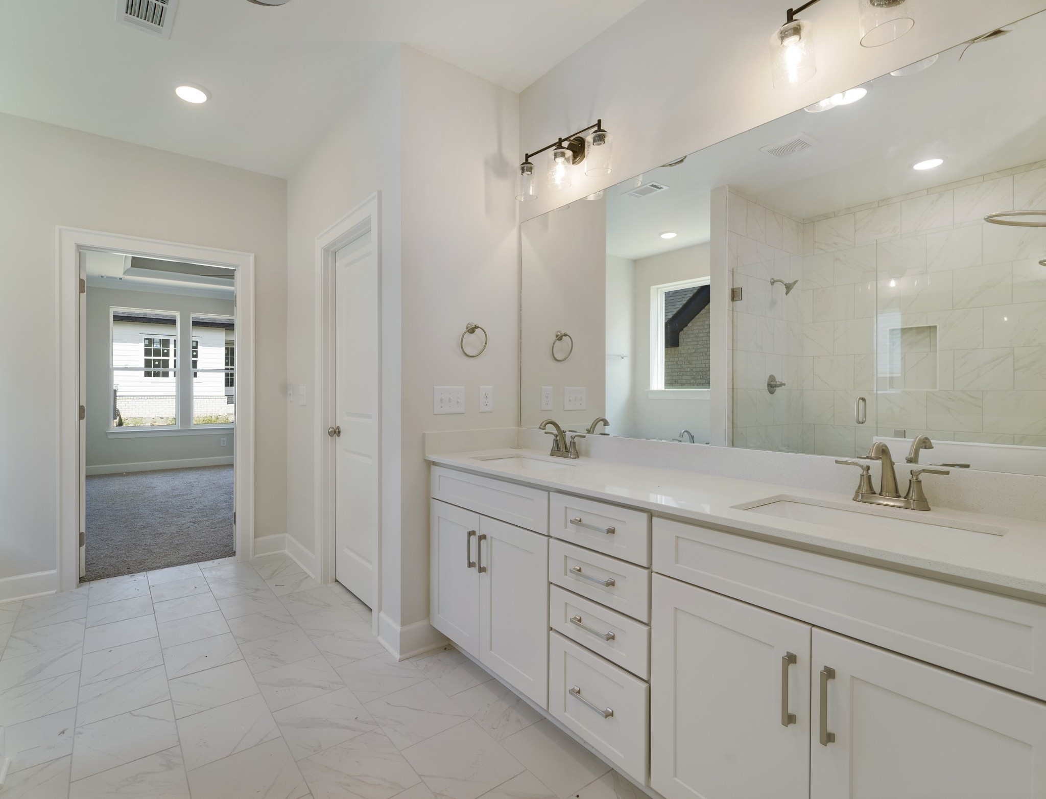 3005 Fanshaw Road Smyrna, TN 37167 - Photo 24 of 40 a spacious bathroom with a granite countertop sink mirror and shower