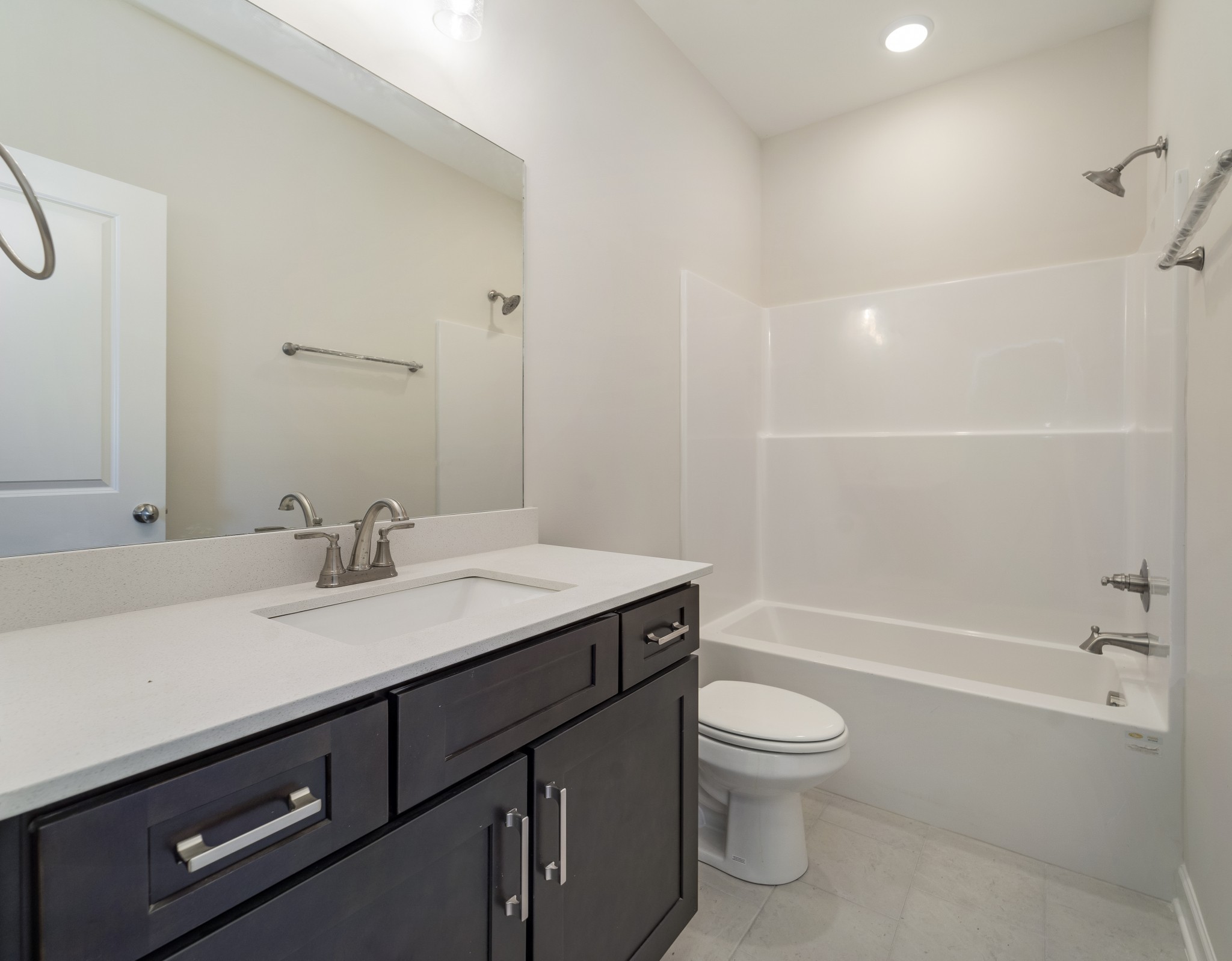 3005 Fanshaw Road Smyrna, TN 37167 - Photo 28 of 40 a bathroom with a granite countertop sink a toilet and shower