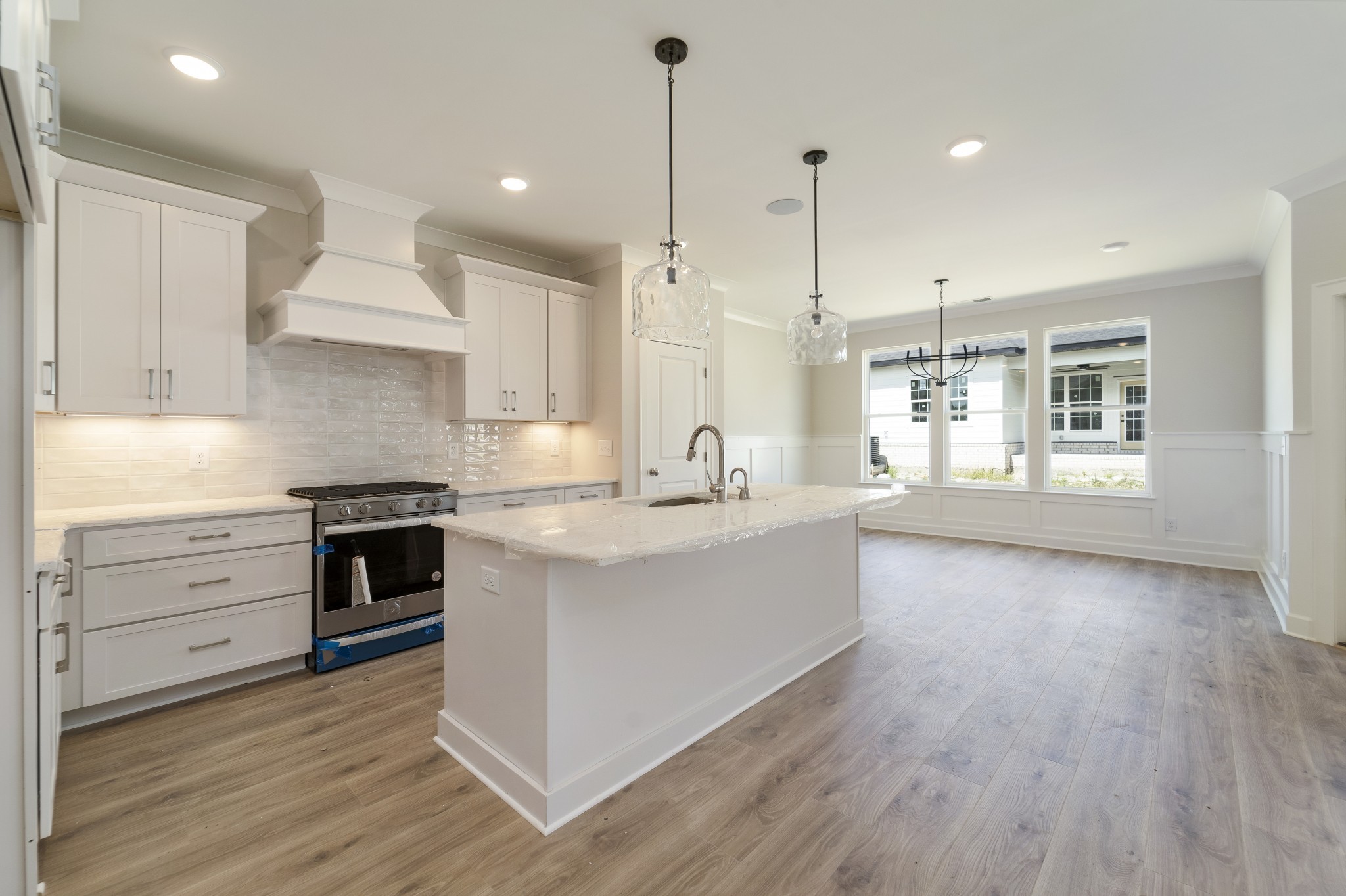 3005 Fanshaw Road Smyrna, TN 37167 - Photo 9 of 40 a kitchen with stainless steel appliances granite countertop a sink a stove and a wooden floors