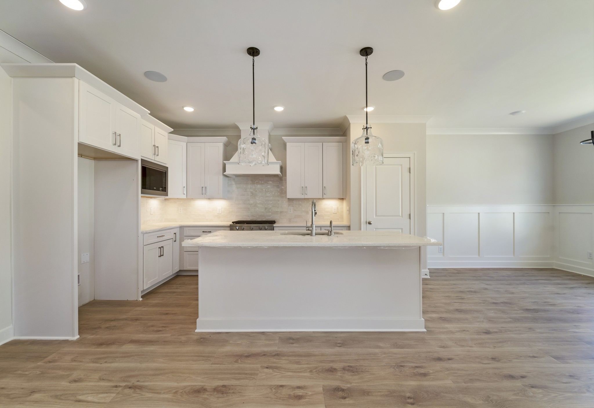3005 Fanshaw Road Smyrna, TN 37167 - Photo 10 of 40 a large kitchen with stainless steel appliances a large counter top a sink a refrigerator and a chandelier