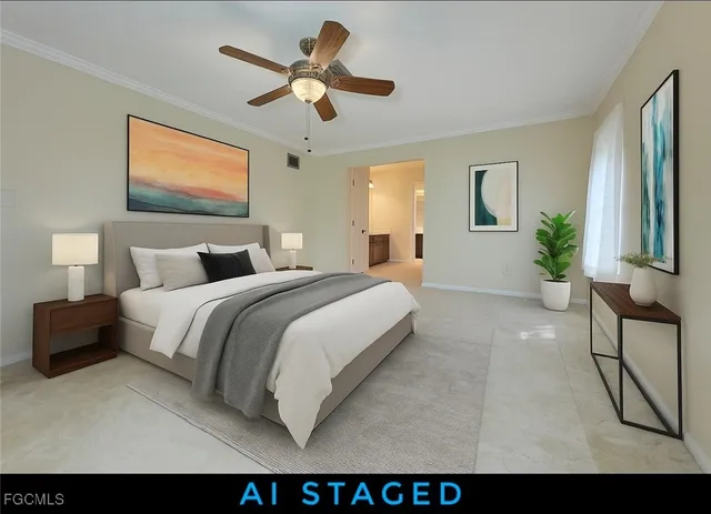 a bedroom with a large bed and a chandelier