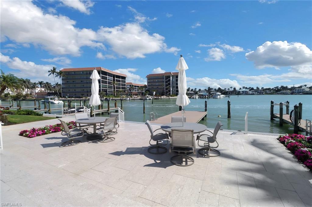 2850 Gulf Shore Boulevard North, Unit 203 Naples, FL 34103 - Photo 19 of 23 View of dock with a water view