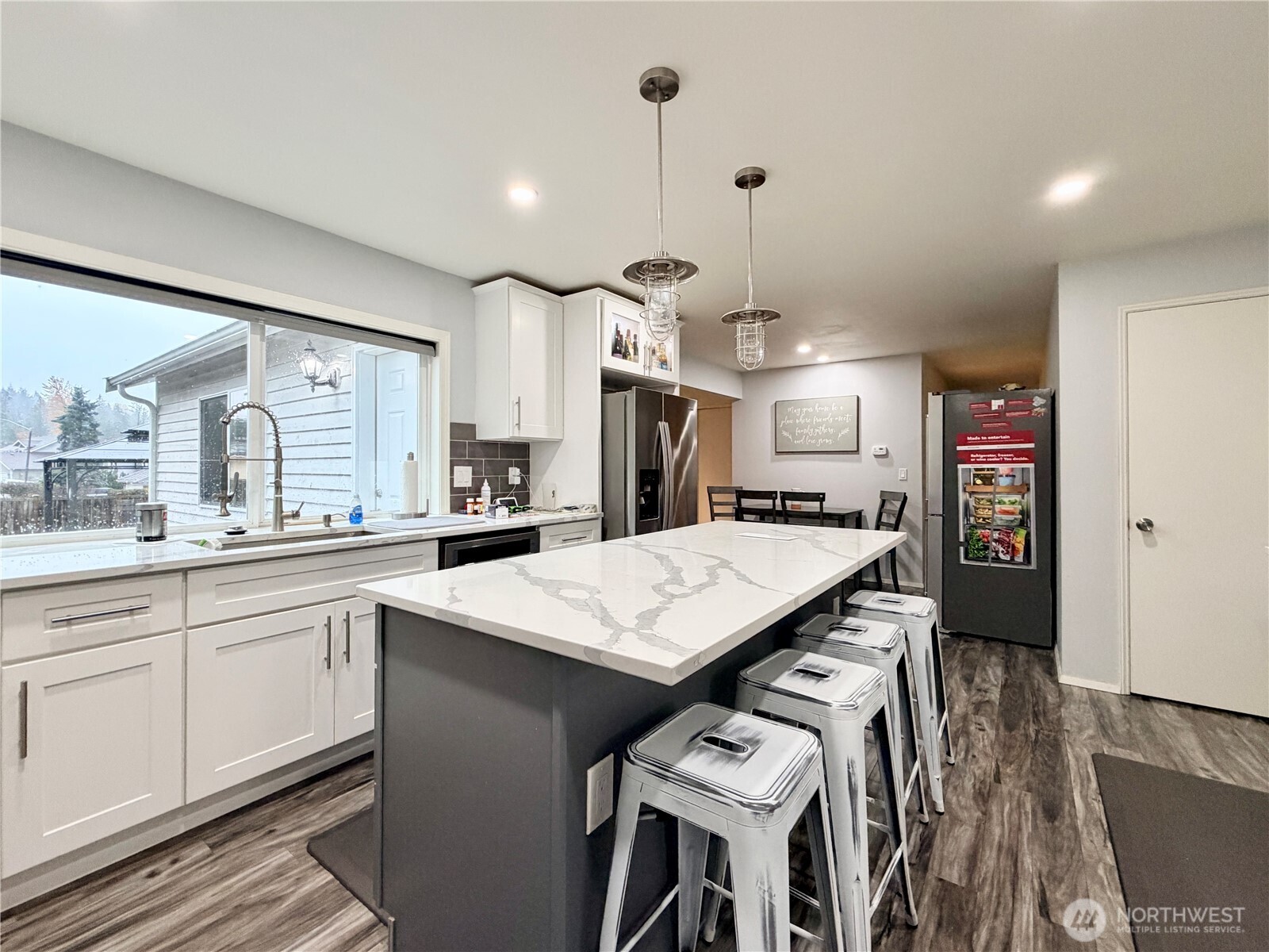 18902 133rd Place Southeast Renton, WA 98058 - Photo 16 of 40 a large kitchen with a table and chairs