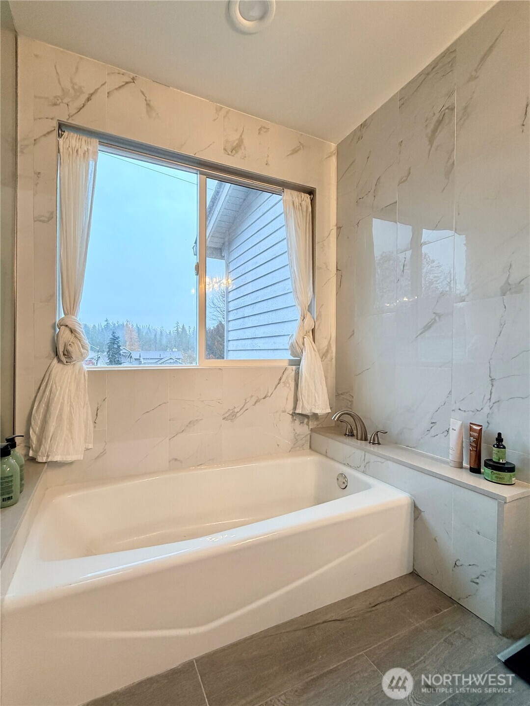 18902 133rd Place Southeast Renton, WA 98058 - Photo 29 of 40 a bathroom with a bathtub and a window