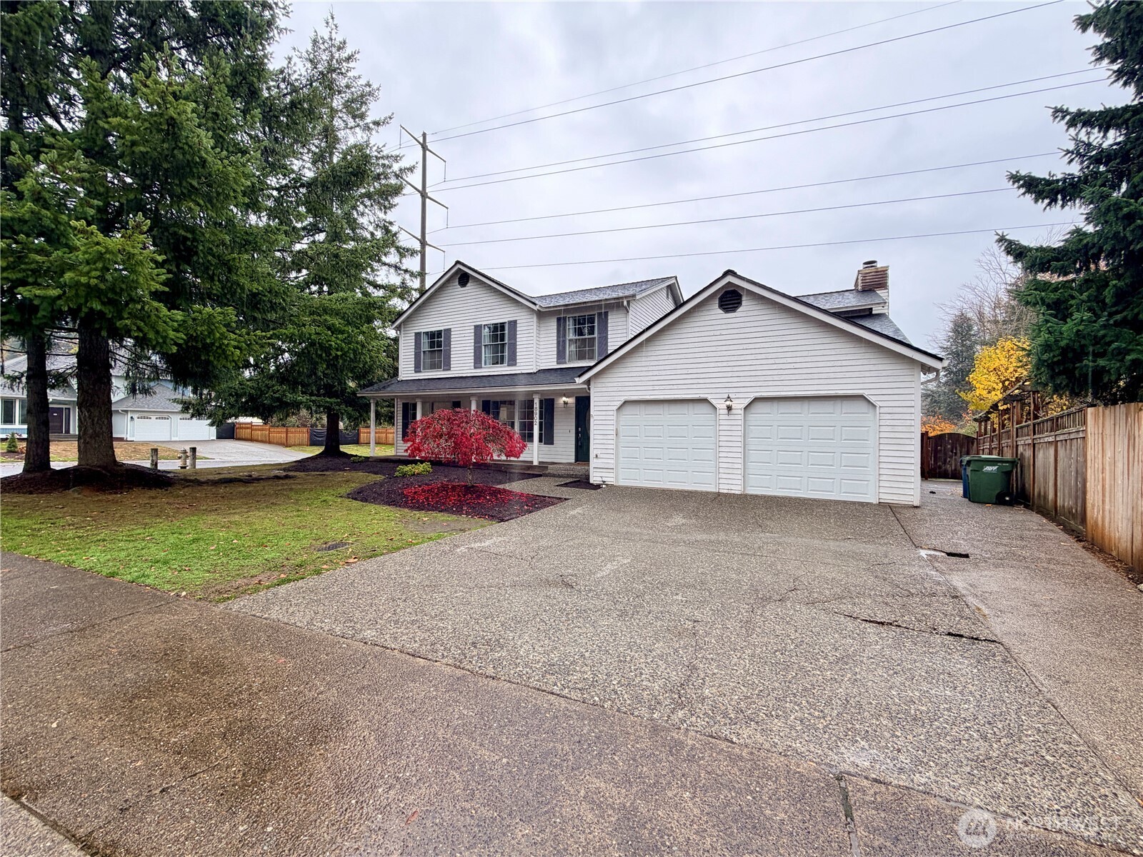 18902 133rd Place Southeast Renton, WA 98058 - Photo 3 of 40 a front view of a house with a yard and garage