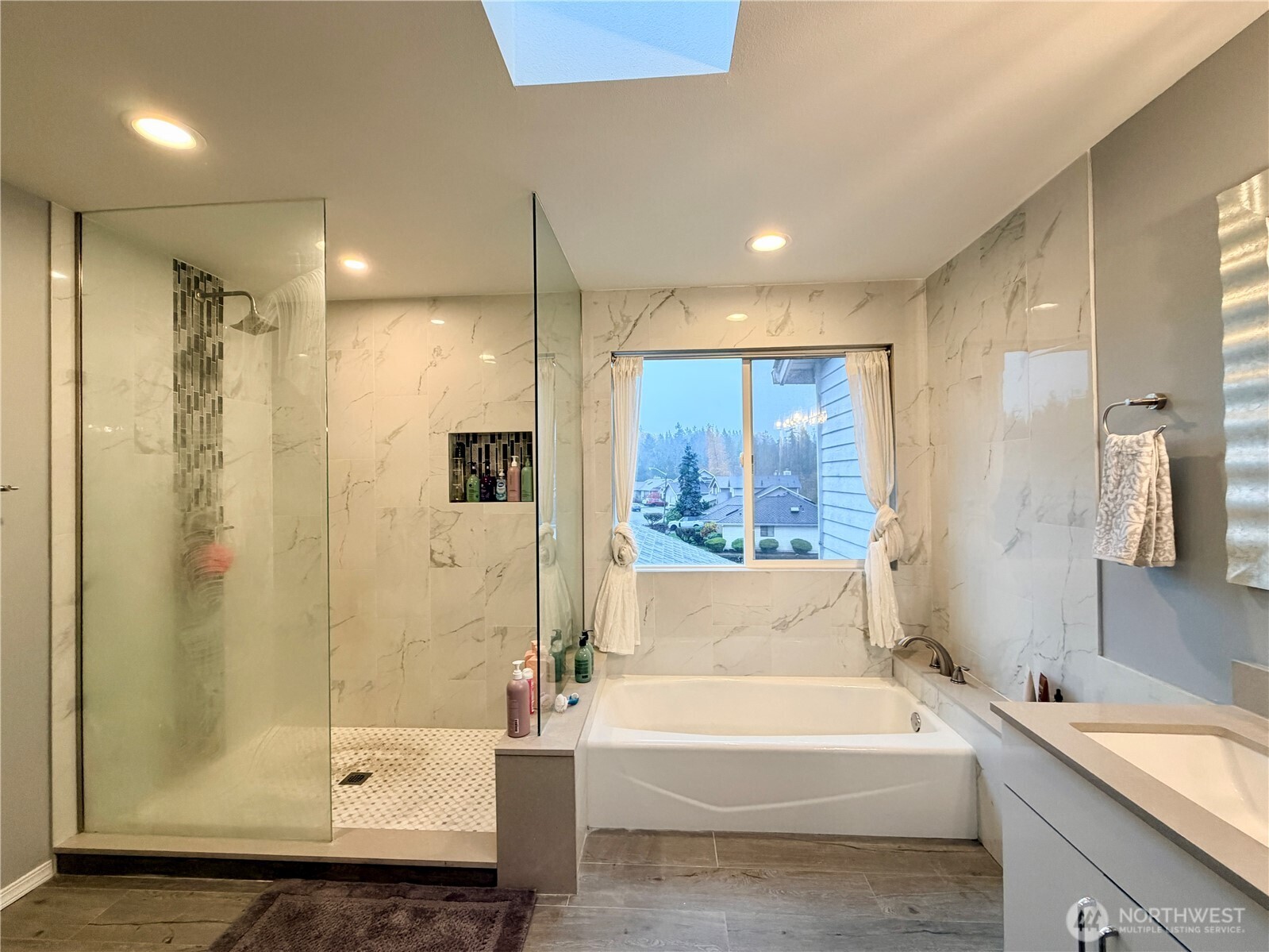 18902 133rd Place Southeast Renton, WA 98058 - Photo 31 of 40 a bathroom with a bathtub and a shower