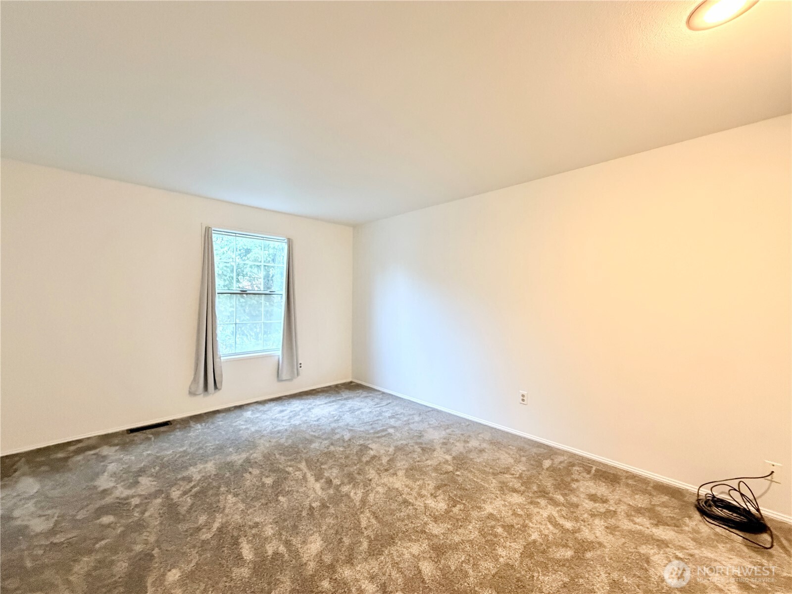 18902 133rd Place Southeast Renton, WA 98058 - Photo 36 of 40 a view of an empty room and a window