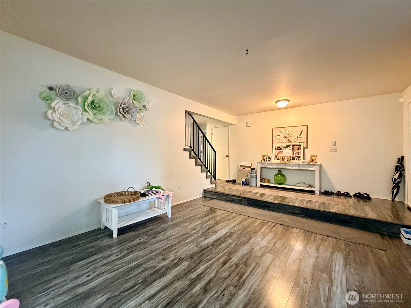 18902 133rd Place Southeast Renton, WA 98058 - Photo 8 of 40 a living room with chair and a wooden floor