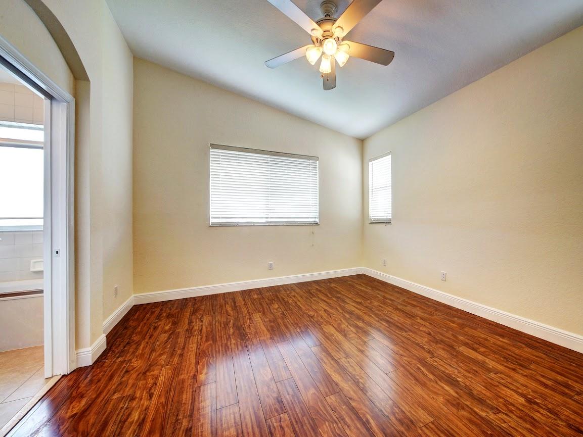 3087 Laurel Ridge Circle Riviera Beach, FL 33404 - Photo 12 of 29 master bedroom