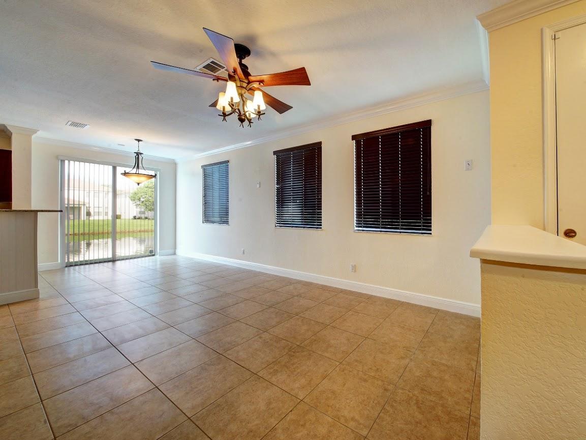 3087 Laurel Ridge Circle Riviera Beach, FL 33404 - Photo 9 of 29 family room/ dinning area