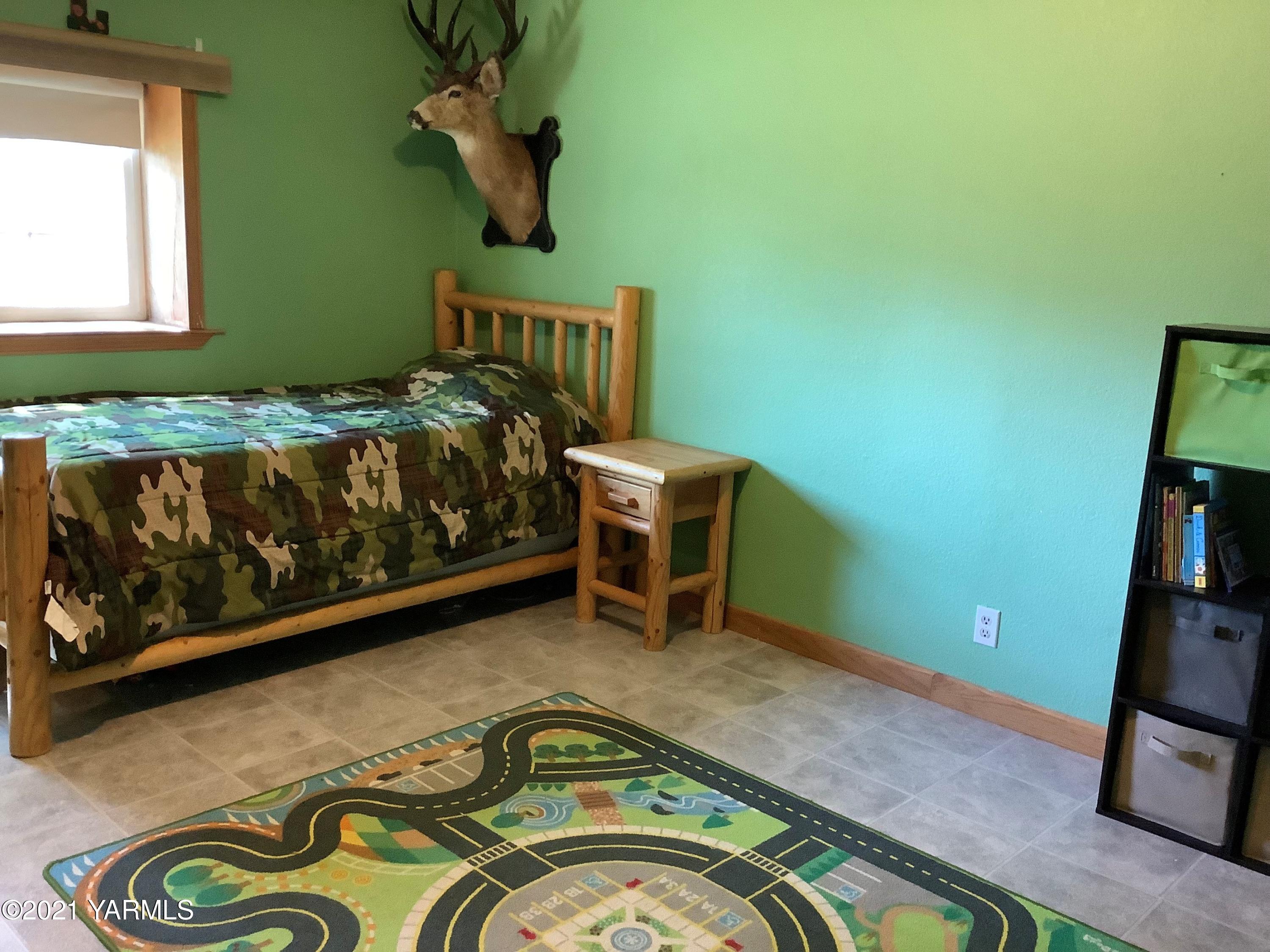 2501 Cook Road Yakima, WA 98908 - Photo 15 of 25 a bedroom with a bed and furniture