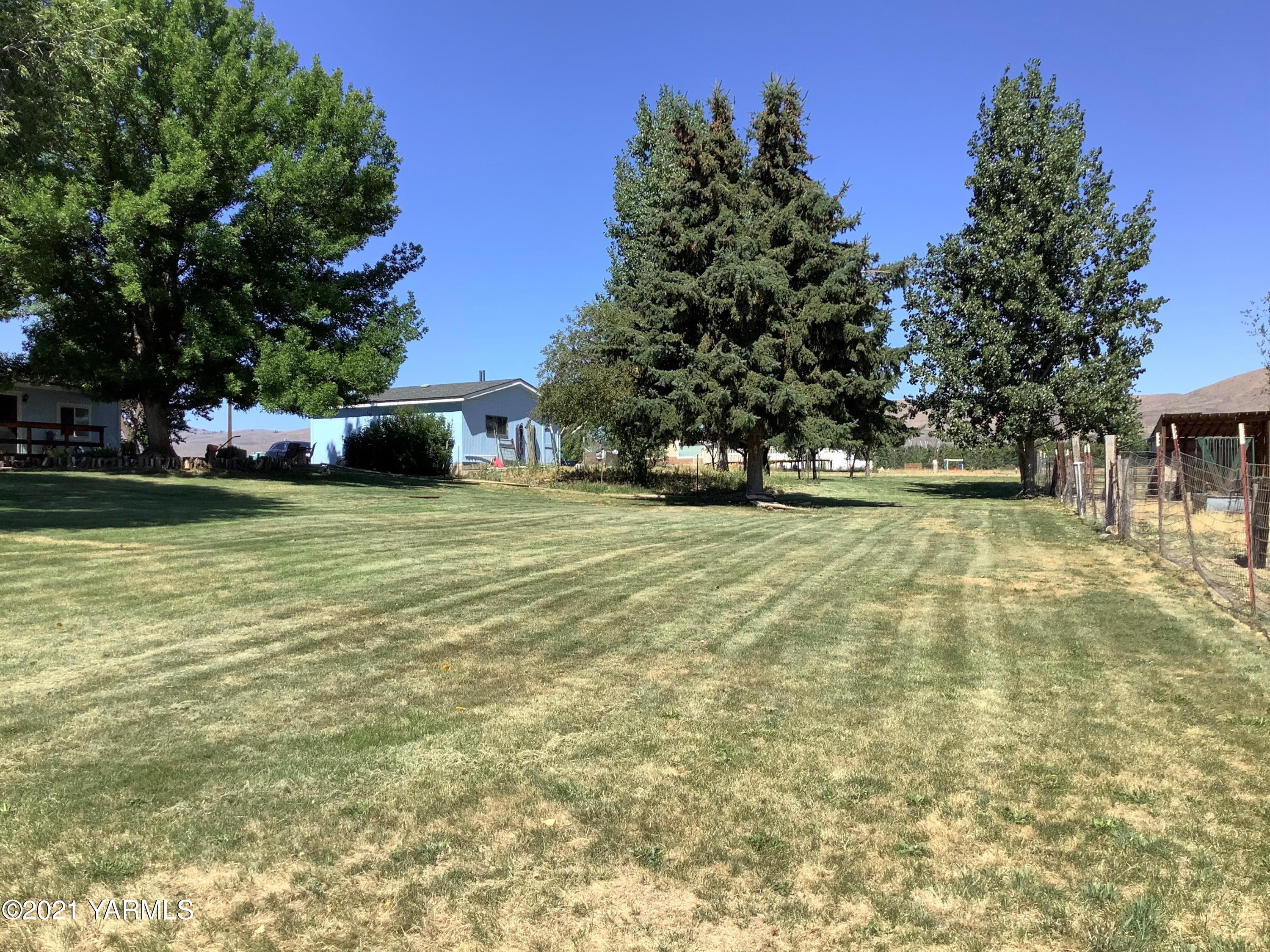 2501 Cook Road Yakima, WA 98908 - Photo 20 of 25 a view of a swimming pool with an outdoor space and seating area