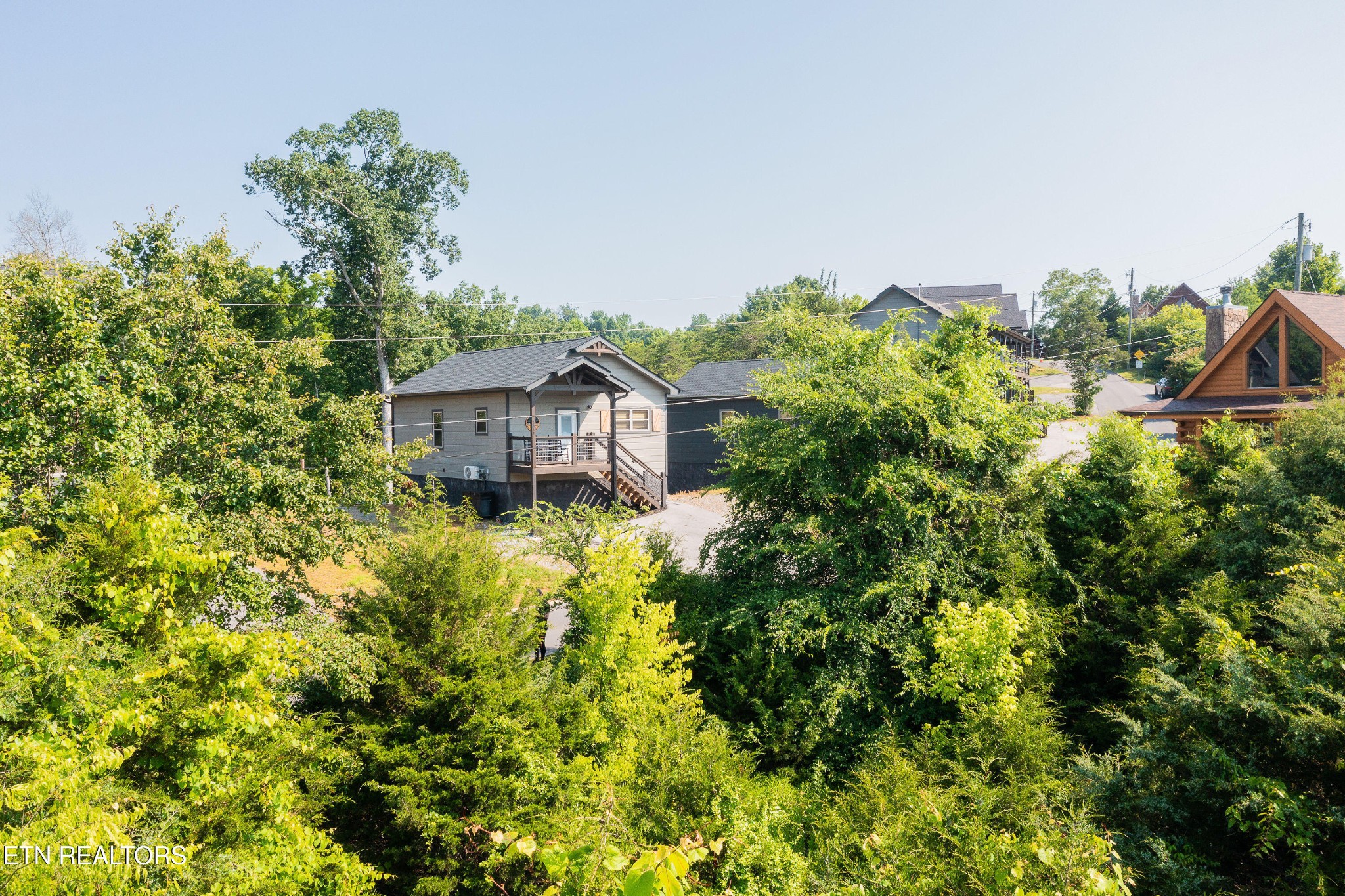 2033 Eagle Feather Drive Sevierville, TN 37876 - Photo 2 of 27 a house view with a garden space