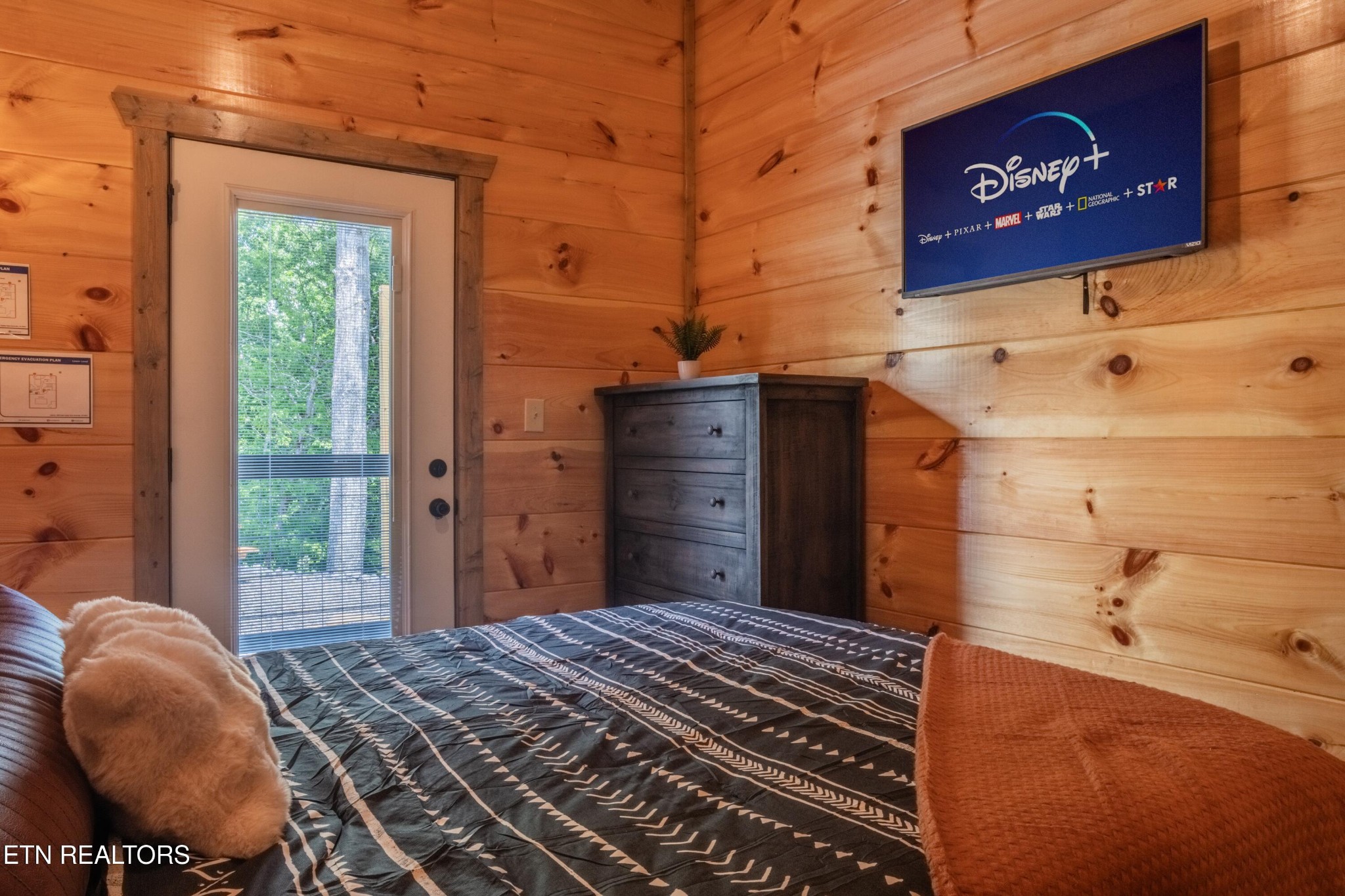 2033 Eagle Feather Drive Sevierville, TN 37876 - Photo 22 of 27 a bedroom with a bed and a dresser