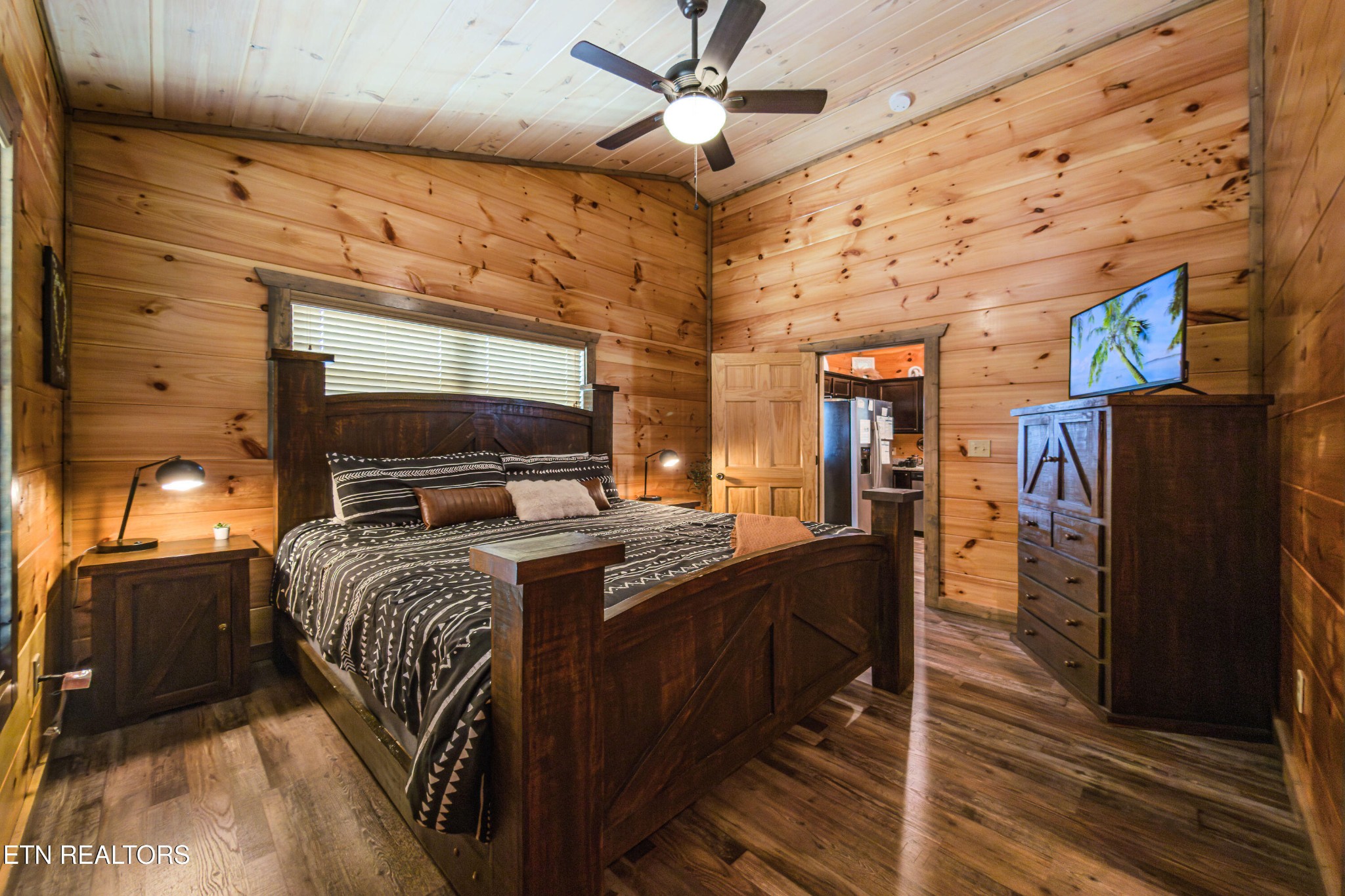 2033 Eagle Feather Drive Sevierville, TN 37876 - Photo 7 of 27 a bedroom with a bed and wooden floor