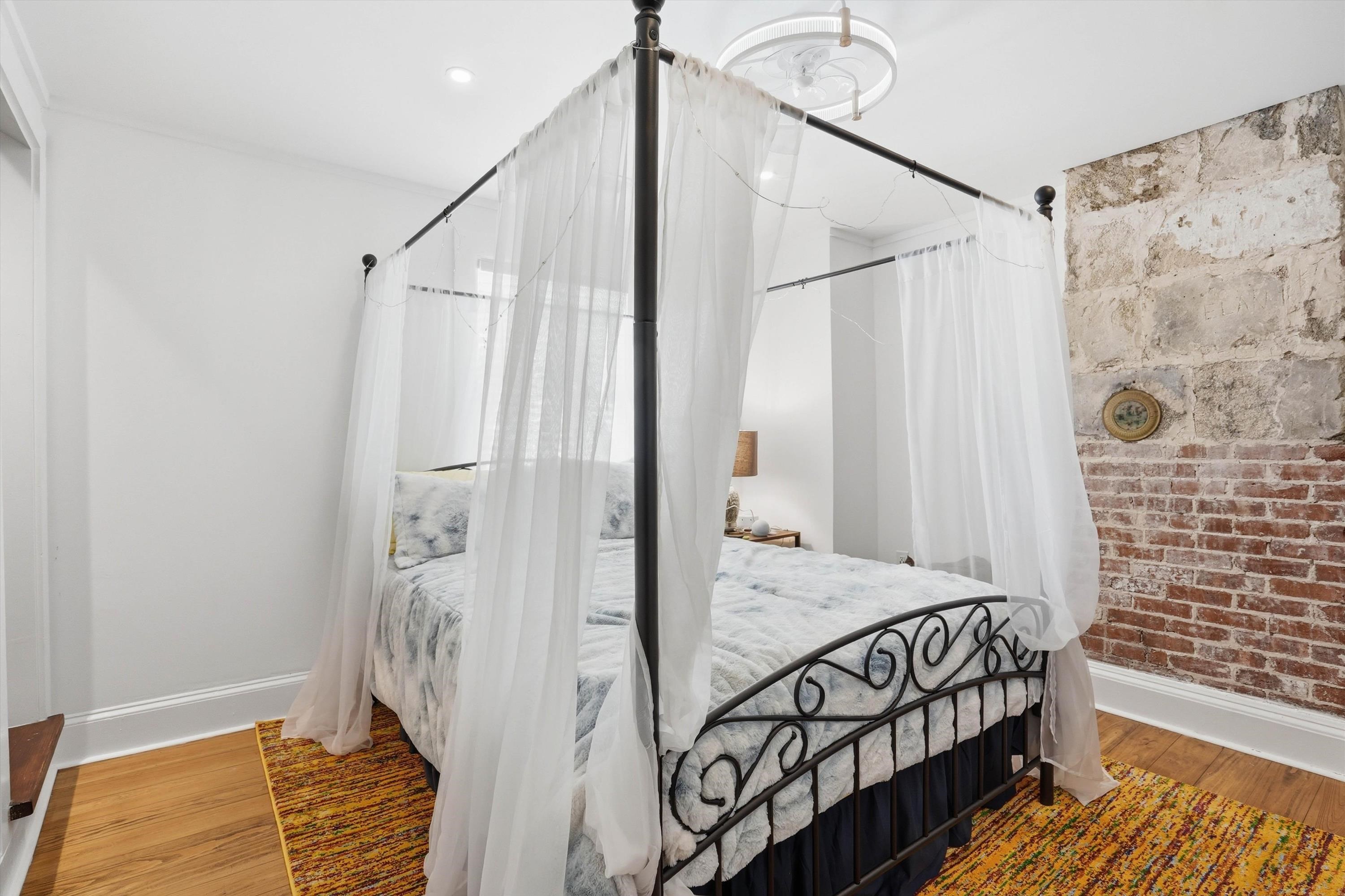 76 Oneida Street St. Augustine, FL 32084 - Photo 17 of 38 a bedroom with a bed and a window
