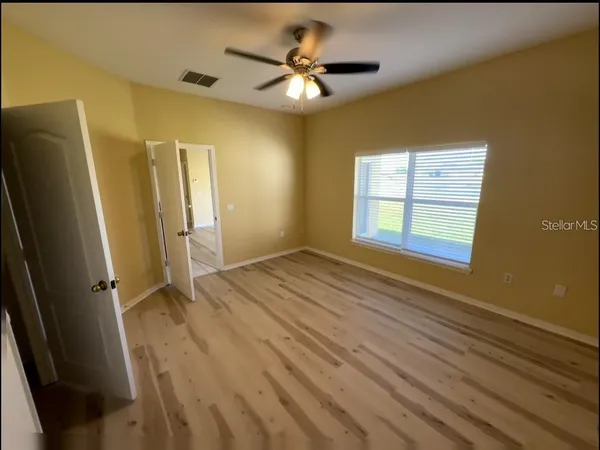 a view of an empty room with a window