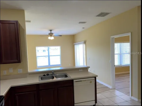 a kitchen with a sink and a window