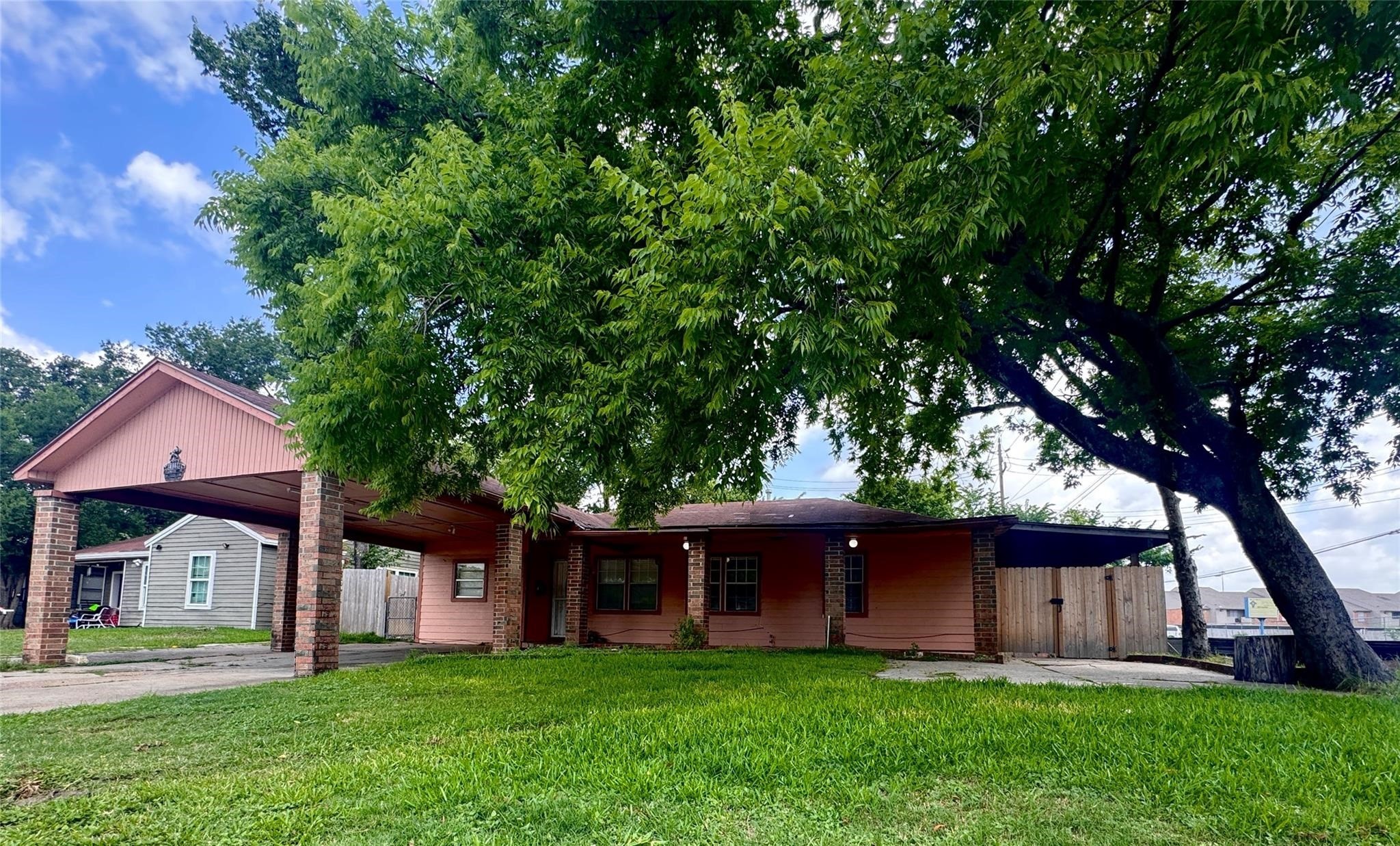 6602 Clemson Street Houston, TX 77092 - Photo 1 of 13 a front view of house with yard and green space