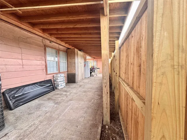 a view of a porch with wooden floor and stairs
