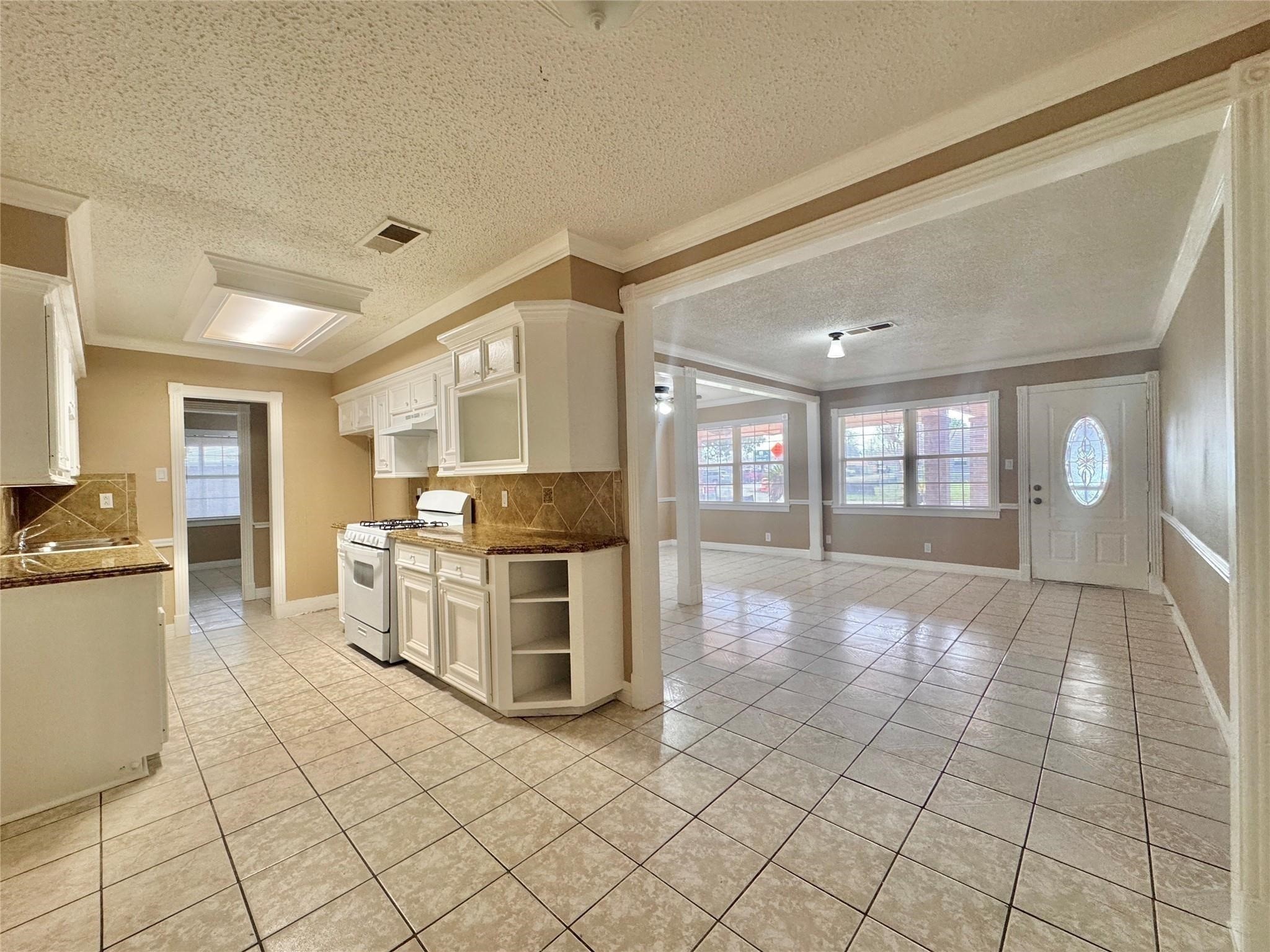 6602 Clemson Street Houston, TX 77092 - Photo 5 of 13 a view of a kitchen with windows