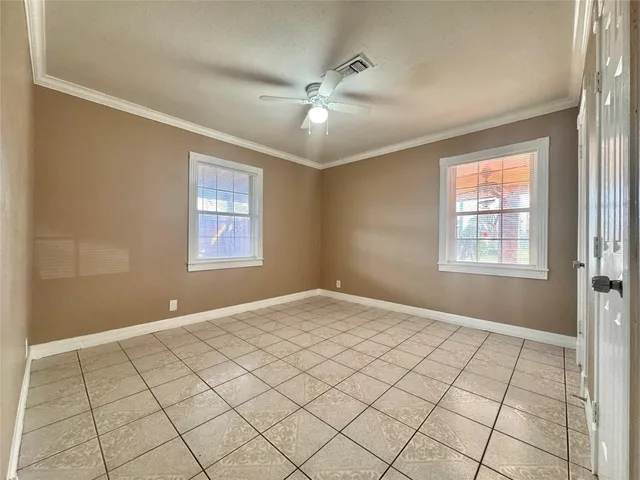 a view of an empty room and window