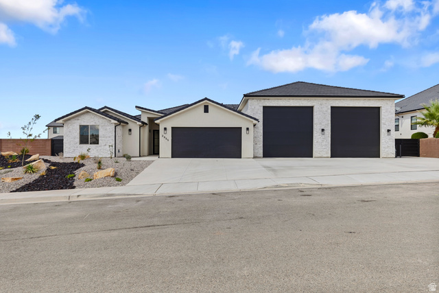 2955 East Rimrunner Drive St. George, UT 84790 - Photo 1 of 35 Contemporary exterior with white brick and stucco finishes
