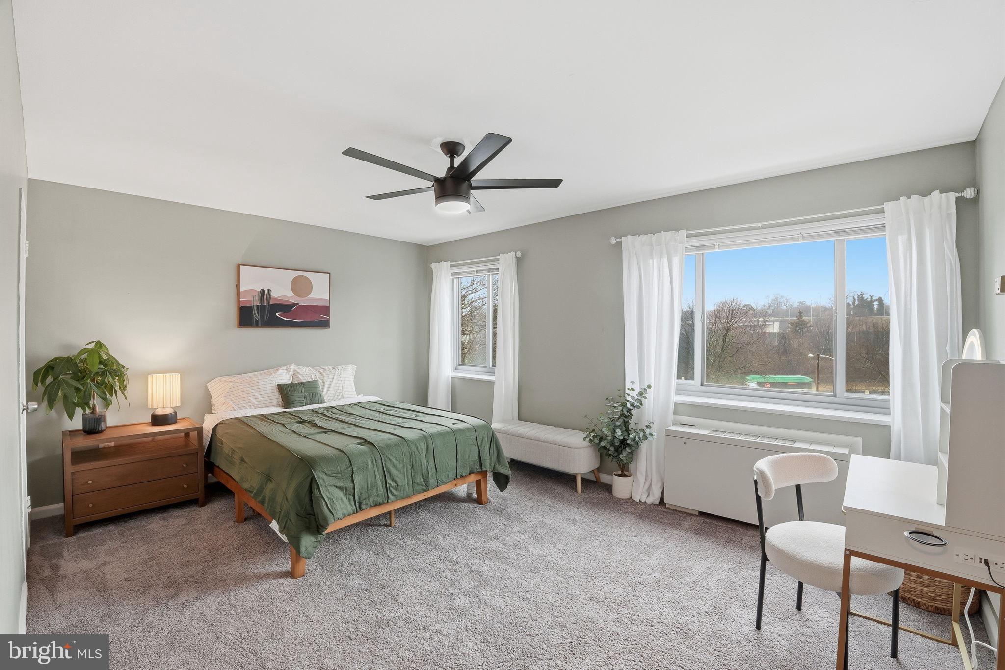 1300 South Arlington Ridge Road, Unit 204 Arlington, VA 22202 - Photo 16 of 35 a living room with a bed furniture and a window
