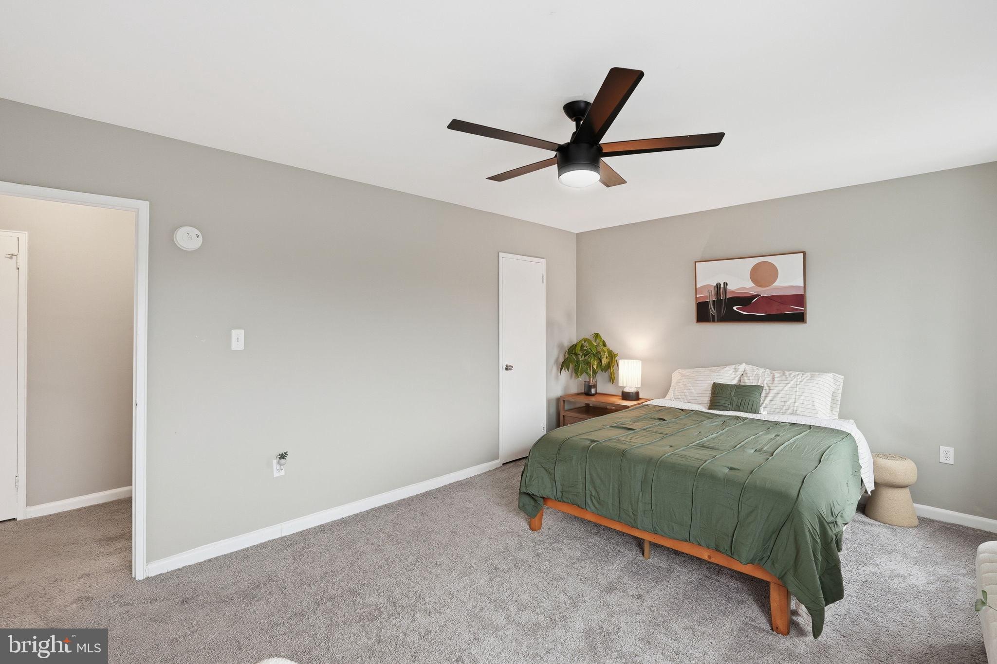 1300 South Arlington Ridge Road, Unit 204 Arlington, VA 22202 - Photo 17 of 35 a bedroom with a bed and painting on the wall